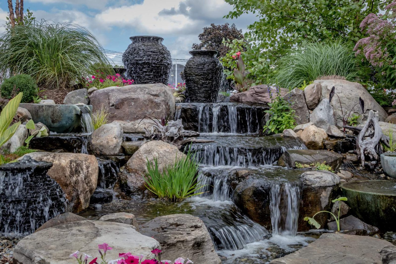 Landscape architecture with waterfall features for summer garden